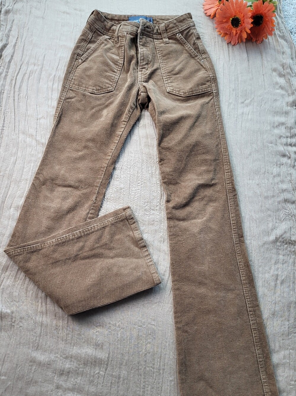 Brown corduroy flared trousers from Indigo Rising in size 00